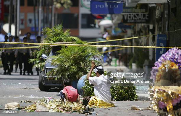 Balinese man prays at a the site of the Kuta suicide bombing during the Balinese Hindu ritual of Galungan October 5, 2005 on Bali, Indonesia....
