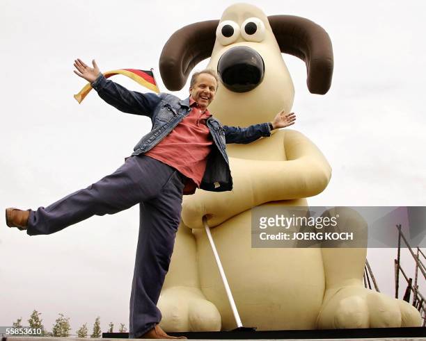 Animation film director Nick Park poses on 05 October 2005 in Munich beside a giant Gromit figure to promote his new film. The movie "Wallace &...