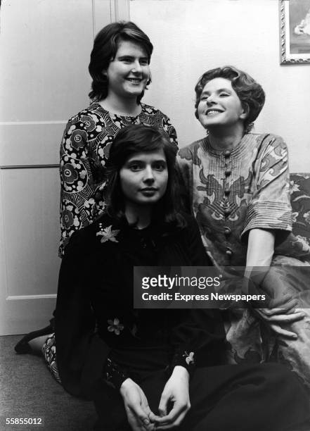 Swedish film and theater actress Ingrid Bergman sits with her twin daughters actress Isabella and academic Ingrid after Bergman's performance as Lady...