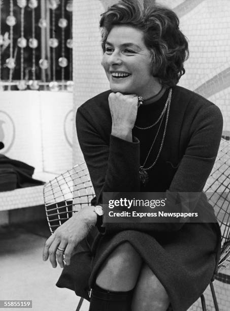 Swedish film and theater actress Ingrid Bergman sits on a wire chair with her hand on her chin and laughs, London, January 6, 1971. Bergman was in...
