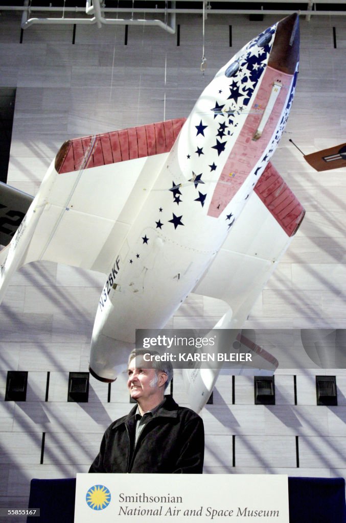 SpaceShipOne designer Burt Rutan stands beneath his craft at the ...