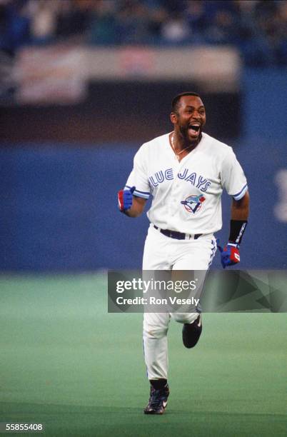 Joe Carter of the Toronto Blue Jays celebrates his home run during game six of the 1993 World Series against the Philadelphia Phillies at the Skydome...