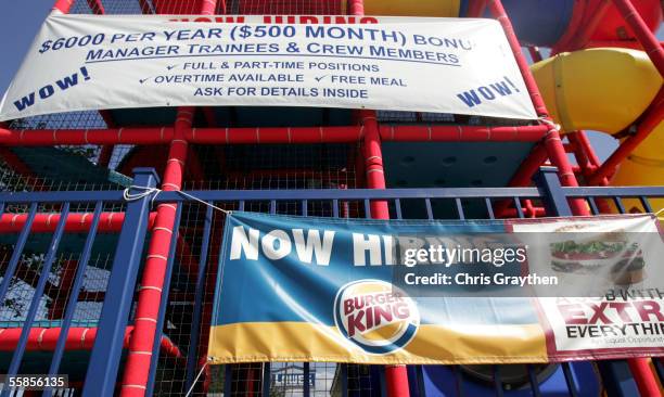 Banners hang outside a Burger King resturant offering new employees a $6,000 signing bonus on October 5, 2005 in Metairie, Louisiana. Hurricane...