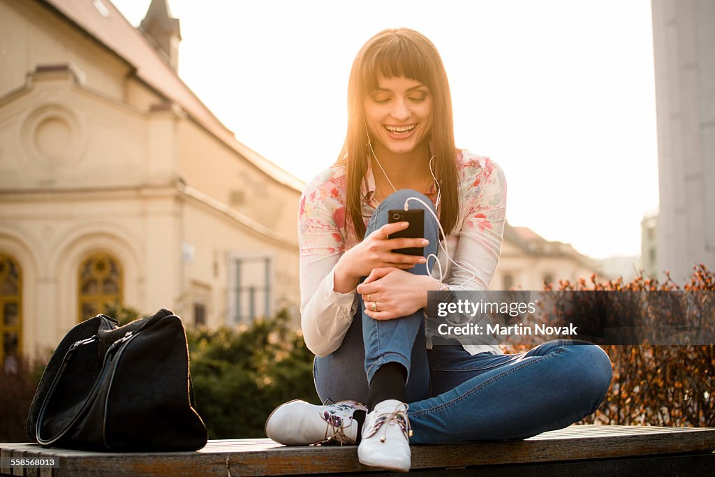 Woman calling phone in street