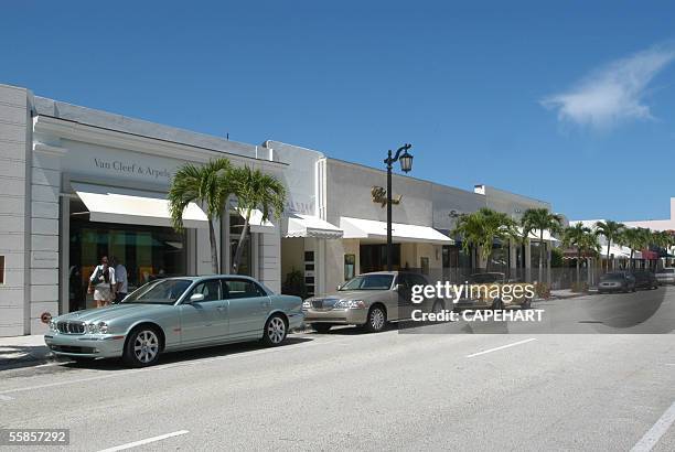 Cars line along the street of Worth Avenue in Palm Beach, Florida.