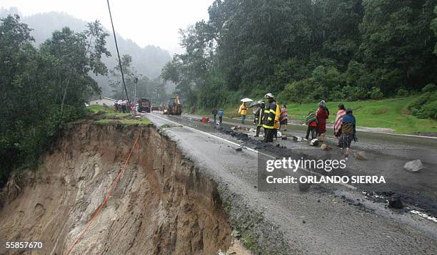 Sector of the Pan American Highway in Guatemala can be seen 05 partially collapsed by the heavy rains 05 October, 2005. Tropical Storm Stan only...