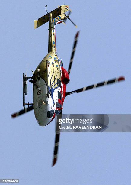An Indian Air Force's Advanced Light Helicopter flies over New Delhi during the final rehearsal for the Indian Air Force Day celebrations, at Palam...