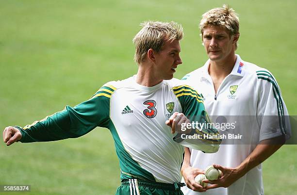 Brett Lee of Australia warms up with team mate Shane Watson as looks on during training at Telstra Dome on October 6, 2005 in Melbourne, Australia.