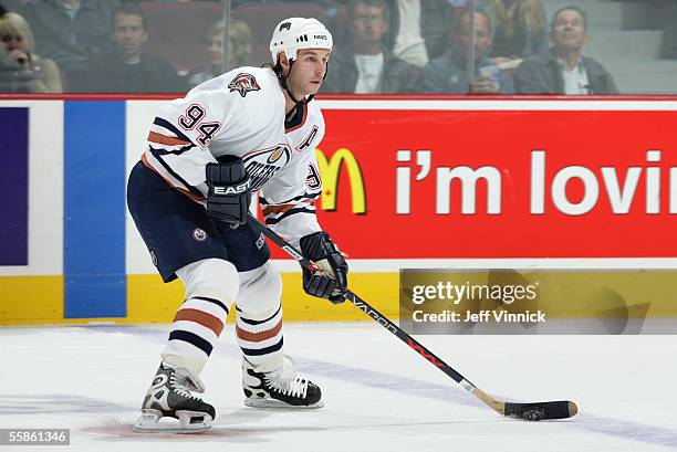 Ryan Smyth of the Edmonton Oilers looks to make a play from the blueline against the Vancouver Canucks during their pre-season NHL game at General...