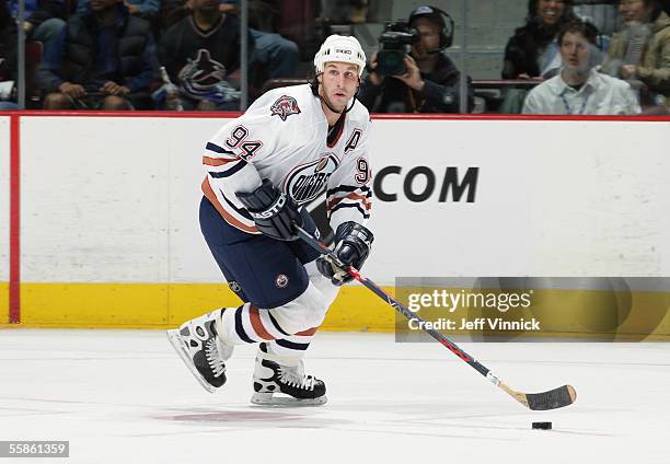 Ryan Smyth of the Edmonton Oilers looks to make a play against the Vancouver Canucks during their pre-season NHL game at General Motors Place on...