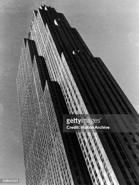 Low angle view of the RCA Building at 30 Rockefeller Plaza in the Rockefeller complex, New York, New York, April 1938.