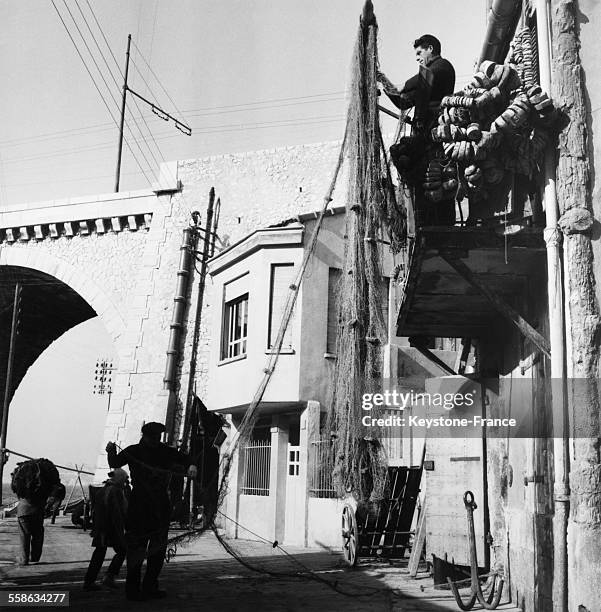 Fishermen Repairing Their Nets in Marseille, France, in 1956.