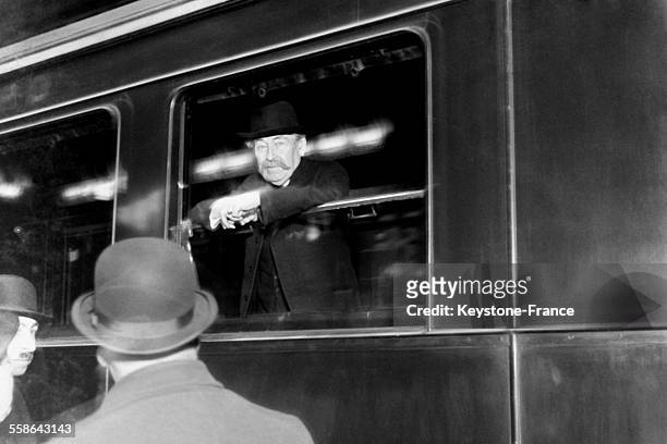 Minister of Foreign Affairs Aristide Briand leaving by train at the Gare du Nord station to attend the London Conference, on February 4, 1930 in...