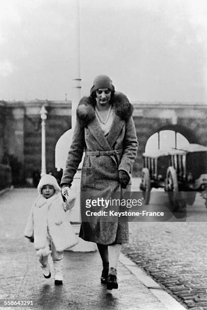 The Duchess of Brabant and her little daughter Princess Josephine Charlotte strolling, on February 18, 1930 in Ostend, Belgium.