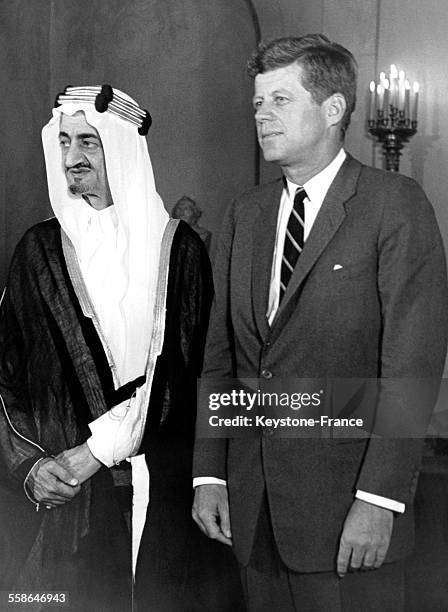 Le Prince héritier Faiçal, ministre des affaires étrangères d'Arabie Saoudite, invité par le président Kennedy à la Maison-Blanche à Washington DC,...