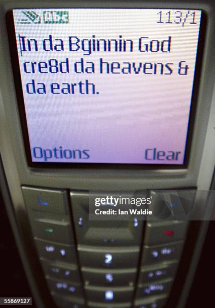 Verse from Genesis in the Bible is seen in SMS text on a mobile phone screen October 7, 2005 in Sydney Australia. The Bible Society in Australia, in...
