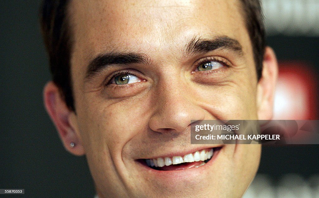 British singer Robbie Williams poses dur