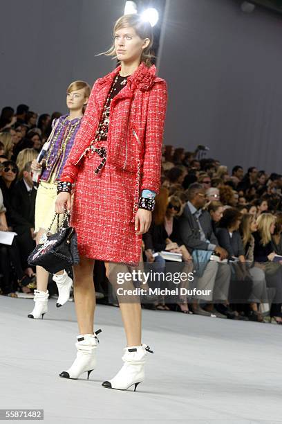 Models walk down the catwalk during the Chanel show as part of Paris Fashion Week Spring/Summer 2006 on October 7, 2005 in Paris, France.