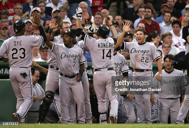 Outfielder Paul Konerko of the Chicago White Sox is congratulated by teammates after hitting a 2 run home run against the Boston Red Sox during Game...