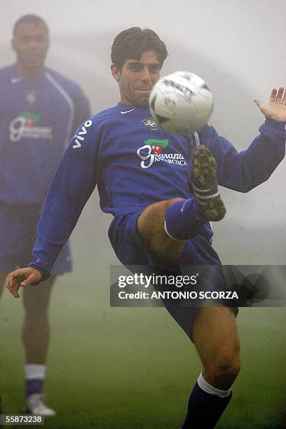 Brazilian soccer player Juninho Pernambucano controls the ball in the fog, during a training session in Teresopolis, 170 km north of Rio de Janeiro,...