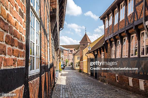 sortebrødregade in ribe with st.catharinae church - ribe denmark stock pictures, royalty-free photos & images
