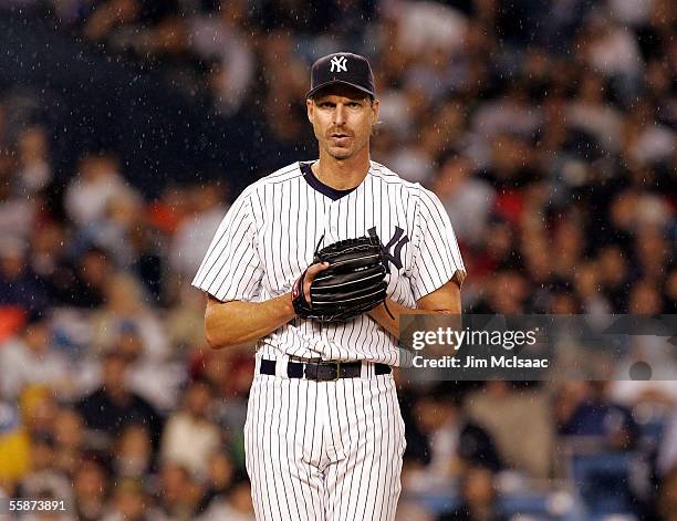 Starting pitcher, Randy Johnson of the New York Yankees stands on the mound against the Los Angeles Angels of Anaheim during Game Three of the...