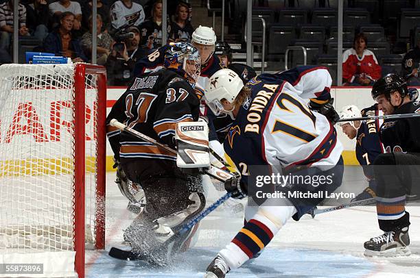 Peter Bondra of the Atlanta Thrashers scores the first goal of the game past goalie Olaf Kolzig of the Washington Capitals during the first period on...