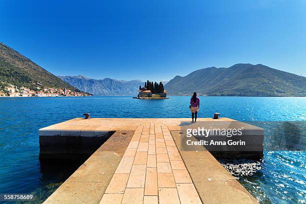 tourist on island off coast of perast, montenegro - our lady of the rocks stock pictures, royalty-free photos & images