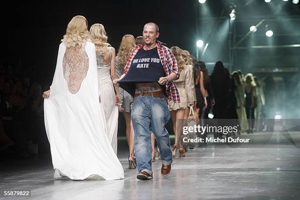 Alexander McQueen and Models walk down the catwalk during the Alexander McQueen show as part of Paris Fashion Week Spring/Summer 2006 on October 7,...