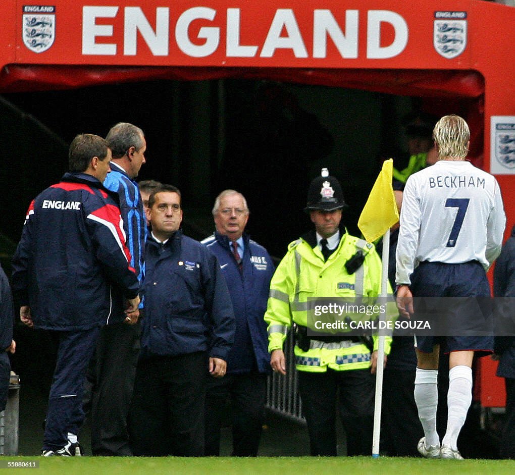 England's captain David Beckham (R) leav