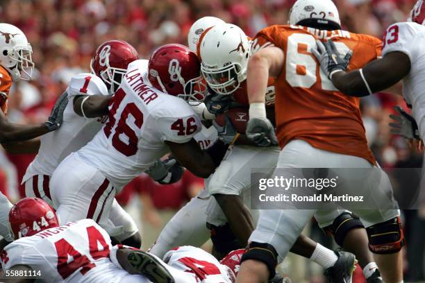 Running back Jamaal Charles of the Texas Longhorns breaks away from Zach Latimer of the Oklahoma Sooners and runs for a touchdown on October 8, 2005...