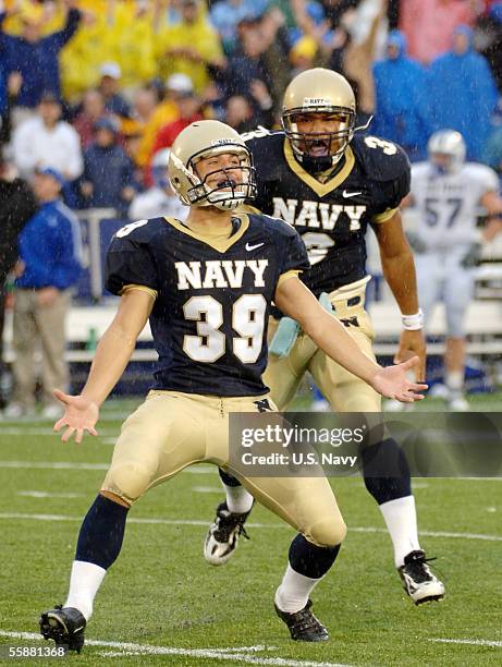 In this handout provieded by the U.S. Navy, U.S. Naval Academy Midshipmen kicker Joey Bullen celebrates his game winning field goal with 4/10ths of a...