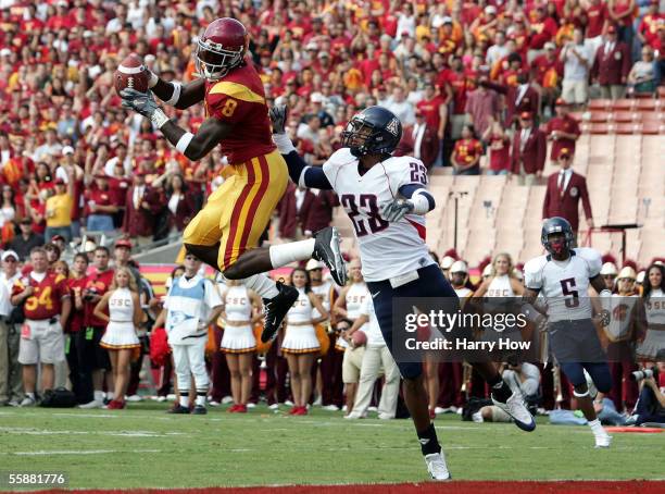 Dwayne Jarrett of USC makes a leaping catch for a touchdown in front of Michael Johnson of Arizona during the second quarter at the Los Angeles...