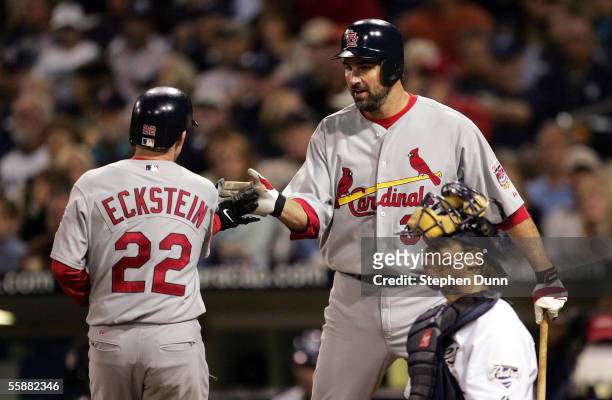 David Eckstein of the St. Louis Cardinals is congratulated by starting pitcher Matt Morris after hitting a two-run home run in the second inning off...