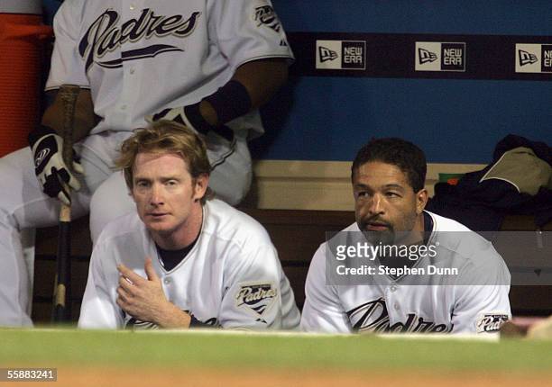 Khalil Greene and Dave Roberts of the San Diego Padres sit in the dugout late in the game against the St. Louis Cardinals during Game Three of the...