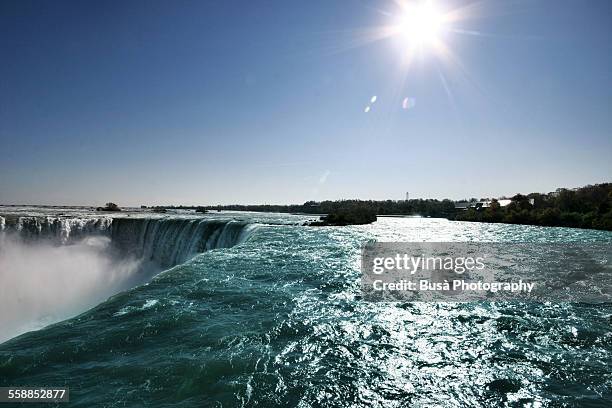 closeup of horseshoe falls at niagara falls - clear sky stock pictures, royalty-free photos & images