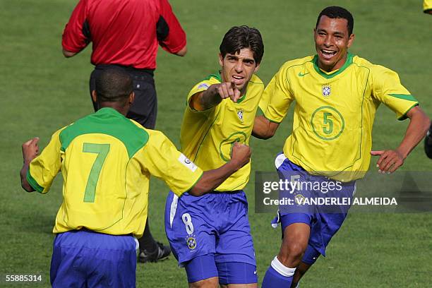 Brazilian Juninho Pernambucano , with teammates Gilberto Silva and Robinho, celebrates his goal against Bolivia during their FIFA World Cup Germany...