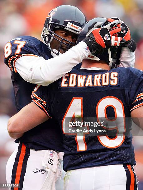 Wide receiver Muhsin Muhammad of the Chicago Bears congratulates fullback Marc Edwards on his touchdown reception in the third quarter against the...