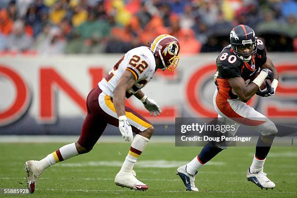 Wide receiver Rod Smith of the Denver Broncos makes a reception and beats Carlos Rogers of the Washington Redskins for a first down at Invesco Field...