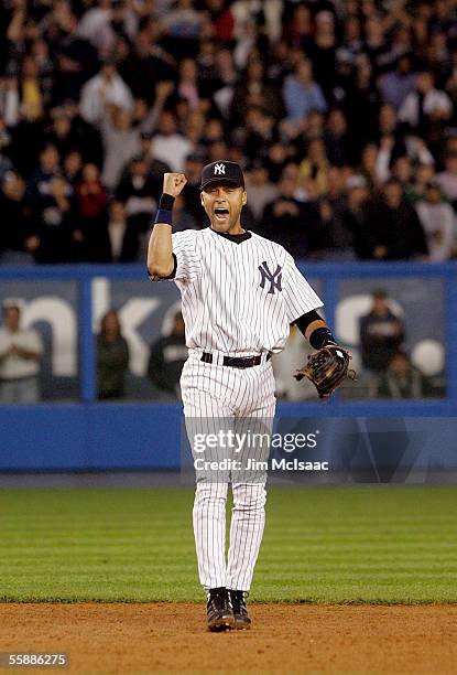 Derek Jeter of the New York Yankees celebrates winning Game Four of the American League Division Series and defeating the Los Angeles Angels of...