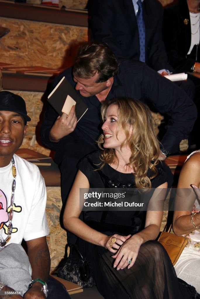 Pharrell Williams and Gillian Anderson watch the Louis Vuitton show News  Photo - Getty Images