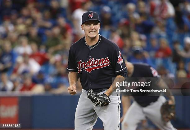 Trevor Bauer of the Cleveland Indians celebrates the last out of their fourteenth consecutive victory during MLB game action against the Toronto Blue...