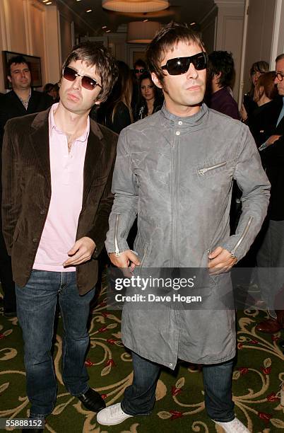 Oasis members Noel and Liam Gallagher arrive at The Q Awards, the annual magazine's music awards, at Grosvenor House on October 10, 2005 in London,...