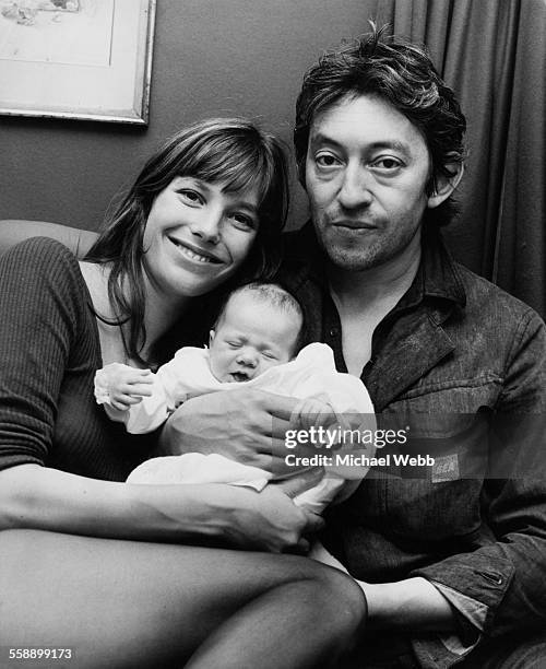 English singer and actress Jane Birkin and French singer-songwriter Serge Gainsbourg with their baby daughter, Charlotte, at Birkin's home in Cheyne...