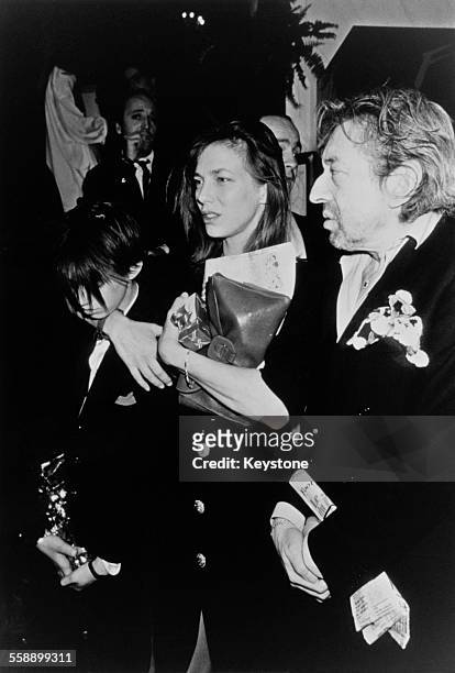 English singer and actress Jane Birkin and French singer-songwriter Serge Gainsbourg with their daughter, Charlotte, at the César film awards, Paris,...