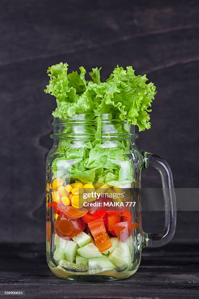 Closeup of fresh salad in a mason jar