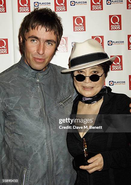 Liam Gallagher and Yoko Ono pose with the award in the awards room after she collected The Q Special Award for the work of her late husband John...