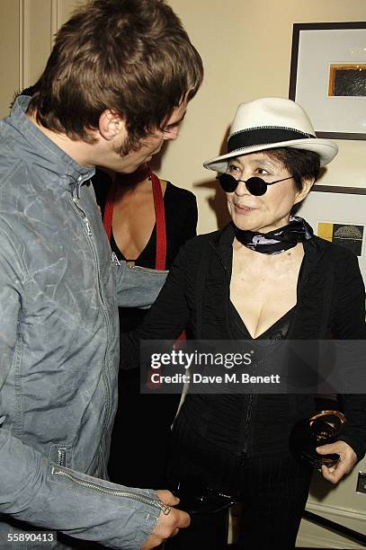 Liam Gallagher and Yoko Ono pose with the award in the awards room after she collected The Q Special Award for the work of her late husband John...