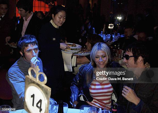 Oasis members Liam Gallagher and Andy Bell and Gallagher's partner Nicole Appleton attend The Q Awards, the annual magazine?s music awards, at...