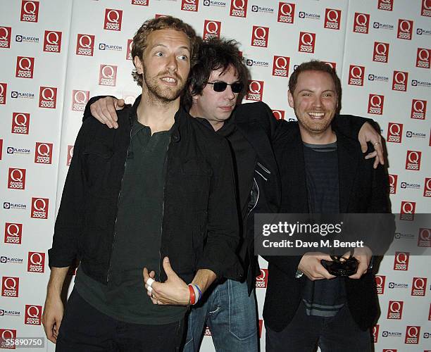 Chris Martin, Ian McCulloch and Johnny Buckland pose in the awards room after Coldplay won the award for Best Act In The World Today at The Q Awards,...